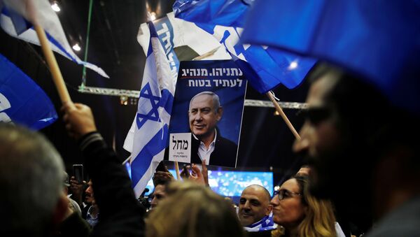 Supporters react as results of the exit polls in Israel's elections are announced at Israeli Prime Minister Benjamin Netanyahu's Likud party headquarters in Tel Aviv, Israel March 2, 2020 - Sputnik International