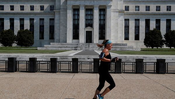 A woman jogs past the Federal Reserve building in Washington, U.S., July 16, 2018 - Sputnik International