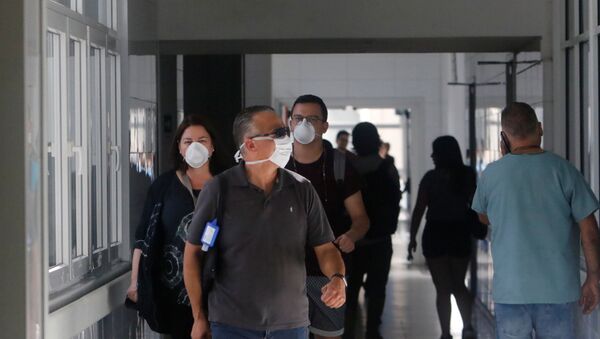 Locals wear masks inside Talca regional hospital in Talca, Chile - Sputnik International