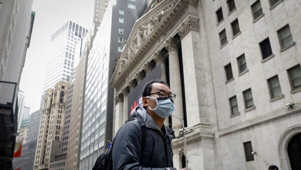 A man wears a mask on Wall St. near the New York Stock Exchange (NYSE) in New York, U.S., March 3, 2020 - Sputnik International