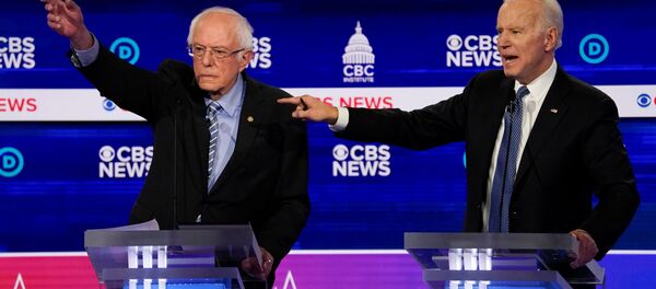 Democratic 2020 U.S. presidential candidates Senator Bernie Sanders and former Vice President Joe Biden have an exchange in the tenth Democratic 2020 presidential debate at the Gaillard Center in Charleston, South Carolina, U.S. February 25, 2020.  - Sputnik International