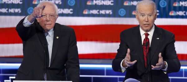 Democratic presidential candidates, Sen. Bernie Sanders, I-Vt., left, and former Vice President Joe Biden gesture during a Democratic presidential primary debate Wednesday, Feb. 19, 2020, in Las Vegas, hosted by NBC News and MSNBC. (AP Photo/John Locher) Democratic presidential candidates, Sen. Bernie Sanders, I-Vt., left, and former Vice President Joe Biden gesture during a Democratic presidential primary debate Wednesday, Feb. 19, 2020, in Las Vegas, hosted by NBC News and MSNBC. (AP Photo/John Locher) - Sputnik International