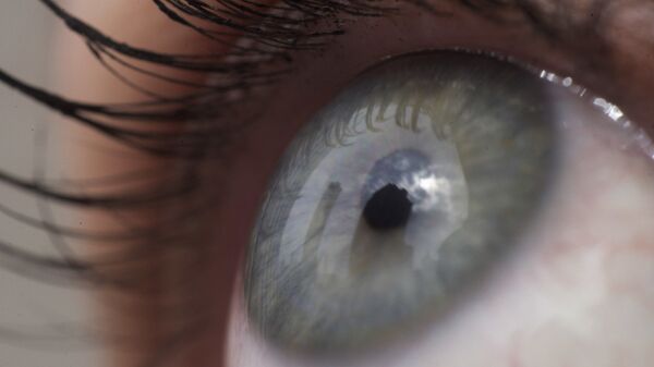 This April 12, 2018 file photo shows the eye of a woman in New York.   Patients are about to be enrolled in the first study to test gene editing inside the body to try to cure an inherited form of blindness. People with the disease have healthy eyes but lack a gene that converts light into signals to the brain that enable sight - Sputnik International