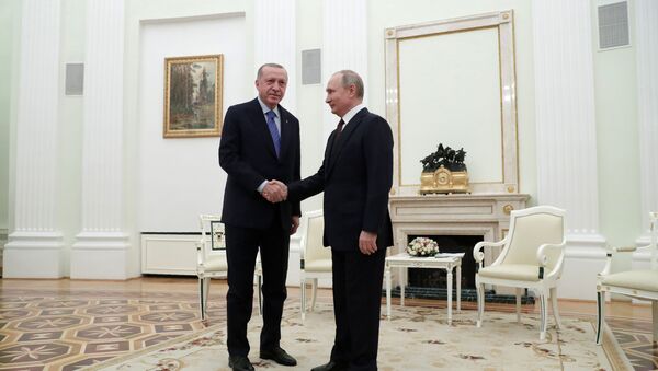 Russian President Vladimir Putin shakes hands with Turkish President Tayyip Erdogan during a meeting in Moscow, Russia March 5, 2020 - Sputnik International