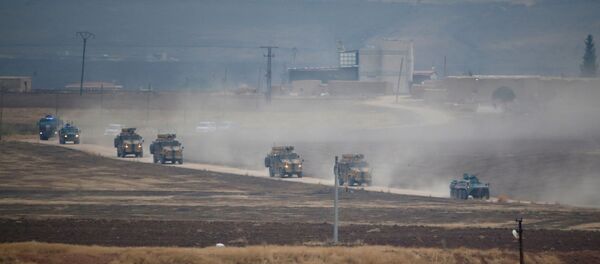 Turkish and Russian military vehicles return following a joint patrol in northeast Syria, as they are pictured from near the Turkish border town of Kiziltepe in Mardin province, Turkey, November 1, 2019 - Sputnik International