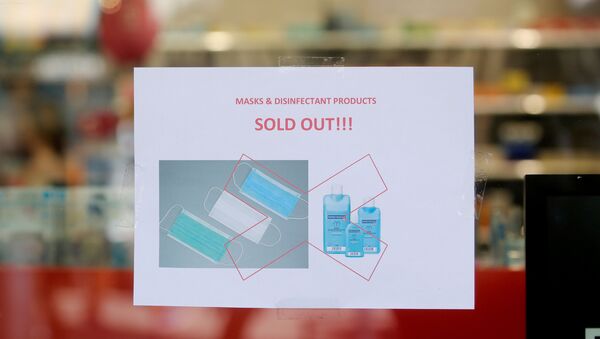 A sign announcing that protection masks and disinfection products are sold out is seen at a pharmacy in Zurich, Switzerland February 28, 2020 - Sputnik International