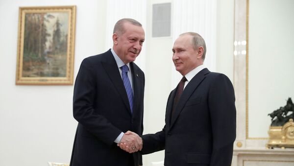 Russian President Vladimir Putin shakes hands with Turkish President Tayyip Erdogan during a meeting in Moscow, Russia March 5, 2020 - Sputnik International