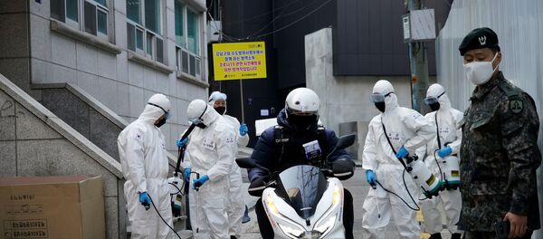 South Korean soldiers in protective gear sanitize a street at a shopping district in Seoul, South Korea, March 6, 2020 South Korean soldiers in protective gear sanitize a street at a shopping district in Seoul, South Korea, March 6, 2020 - Sputnik International