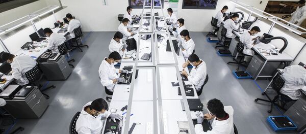 Plant workers remanufacture laptops in a process lasting five hours at the Circular Computer facility in the UAE Plant workers remanufacture laptops in a process lasting five hours at the Circular Computer facility in the UAE - Sputnik International