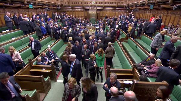 FILE PHOTO: MPs leave the House of Commons to vote in the election of the new Speaker of the House, in London, Britain November 4, 2019, in this screen grab taken from video. Parliament TV via REUTERS./File Photo - Sputnik International