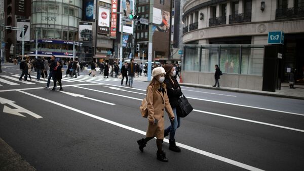 Women, wearing protective face masks walk in Tokyo - Sputnik International