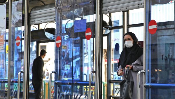 An Iranian woman wears a protective mask in the capital Tehran on March 4, 2020. - Sputnik International