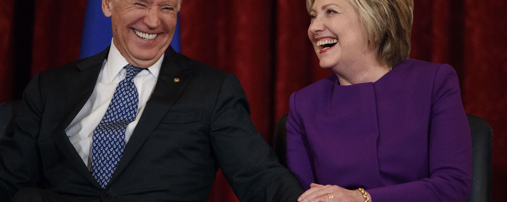 Vice President Joe Biden, left, laughs with former Secretary of State Hillary Clinton during a ceremony to unveil a portrait of Senate Minority Leader Harry Reid, D-Nev., on Capitol Hill, Thursday, Dec. 8, 2016, in Washington. - Sputnik International, 1920, 22.11.2020