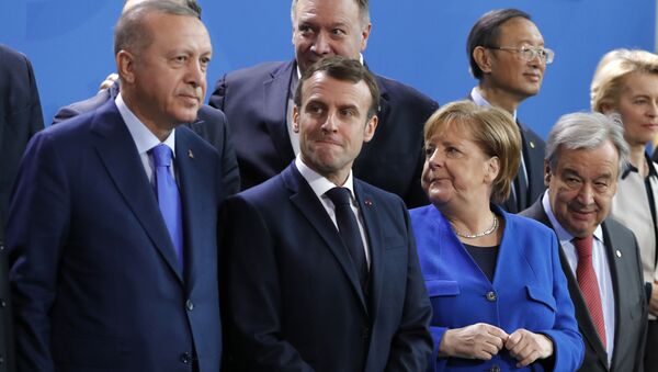 Turkish President Recep Tayyip Erdogan, French President Emmanuel Macron, German Chancellor Angela Merkel and Secretary-General of the United Nations (UN) Antonio Guterres wait prior to a family picture during a Peace summit on Libya at the Chancellery in Berlin, on January 19, 2020. - Sputnik International