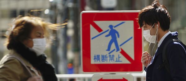 Pedestrians with protective masks on a street Thursday, 5 March 2020, in Tokyo. The number of infections of the COVID-19 disease spread around the globe. Pedestrians with protective masks on a street Thursday, 5 March 2020, in Tokyo. The number of infections of the COVID-19 disease spread around the globe. - Sputnik International