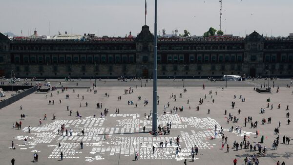 Women paint names of femicide victims during International Women's Day at Zocalo square, in Mexico City, Mexico March 8, 2020 - Sputnik International