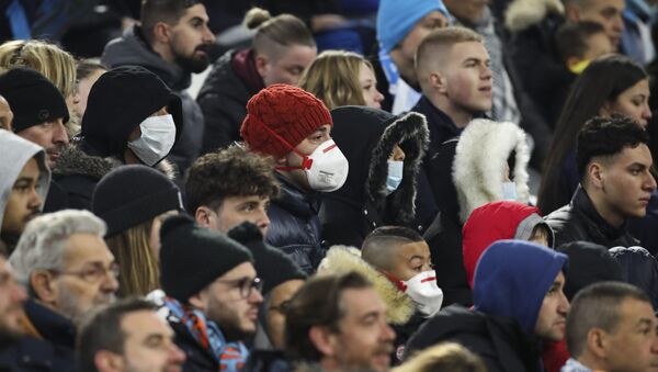 Supporters with protective masks at the Velodrome stadium in Marseille - Sputnik International