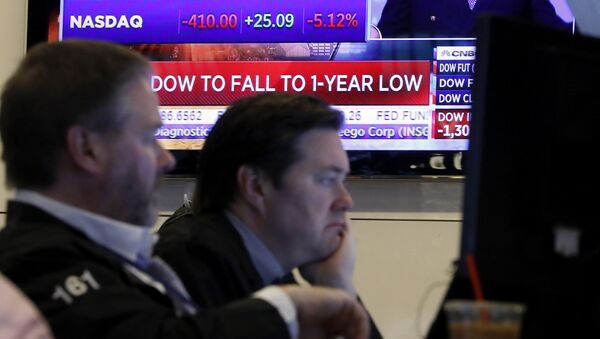 A television screen headlines news as traders prepare for the day's activity on the floor of the New York Stock Exchange, Monday, March 9, 2020. Trading in Wall Street futures has been halted after they fell by more than the daily limit of 5%. - Sputnik International