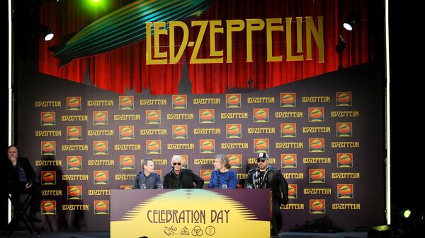 Led Zeppelin, from left, bassist/keyboardist John Paul Jones, guitarist Jimmy Page, singer Robert Plant, and drummer Jason Bonham participate in a press conference ahead of the worldwide theatrical release of Celebration Day, a concert film of their 2007 London O2 arena reunion show, at the Museum of Modern Art on Tuesday, Oct. 9, 2012 in New York. - Sputnik International