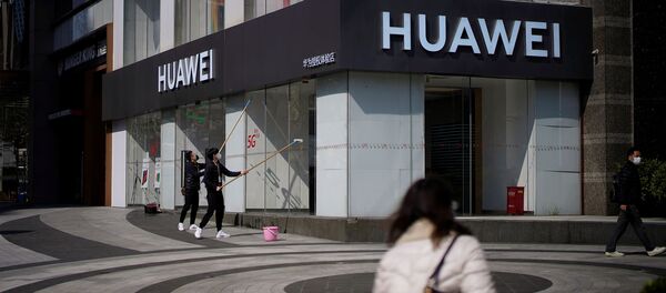 People wearing face masks are seen at a Huawei shop People wearing face masks are seen at a Huawei shop - Sputnik International