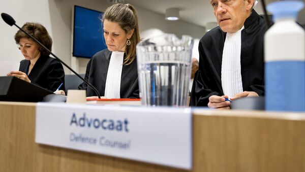 Sabine ten Doesschate (C) and Boudewijn van Eijck (R) lawyers of suspect Oleg Pulatov sit in the courtroom at the Schiphol Judicial Complex, on March 10, 2020 on the second day of the trial of four men accused of murder over the downing of Malaysia Airlines flight MH17 in 2014 - Sputnik International