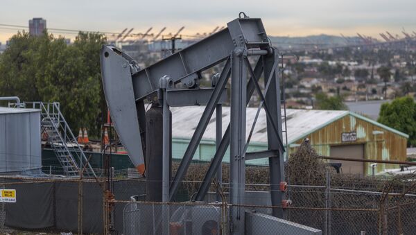 Pump jacks draw crude oil from the Long Beach Oil Field in Signal Hill, California, on March 9, 2020. - Sputnik International