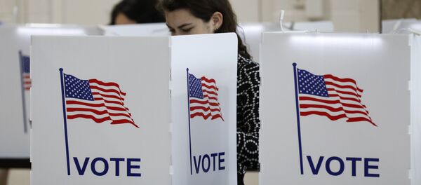 People vote in the Michigan primary election at Chrysler Elementary School in Detroit, Michigan, on March 10, 2020 - Sputnik International