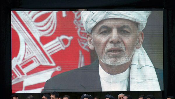  A screen shows the broadcast of Afghanistan's President Ashraf Ghani - Sputnik International
