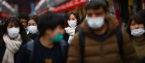 Tourists wearing protective face masks, following an outbreak of the coronavirus disease (COVID-19), visit Asakusa neighbourhood in Tokyo, Japan March 8, 2020 Tourists wearing protective face masks, following an outbreak of the coronavirus disease (COVID-19), visit Asakusa neighbourhood in Tokyo, Japan March 8, 2020 - Sputnik International