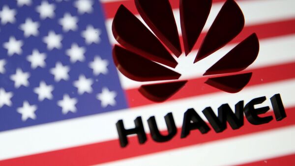 A 3D printed Huawei logo is placed on glass above displayed US flag in this illustration taken January 29, 2019. - Sputnik International