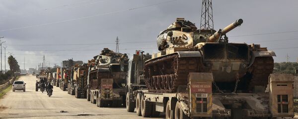 Turkish military convoy drives through the village of Binnish, in Idlib province, Syria, Saturday, Feb. 8, 2020 Turkish military convoy drives through the village of Binnish, in Idlib province, Syria, Saturday, Feb. 8, 2020 - Sputnik International
