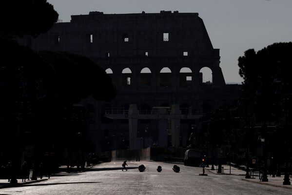 The Colosseum is virtually deserted after a decree orders for the whole of Italy to be on lockdown in an unprecedented clampdown aimed at beating the coronavirus, in Rome, Italy, March 10, 2020 - Sputnik International