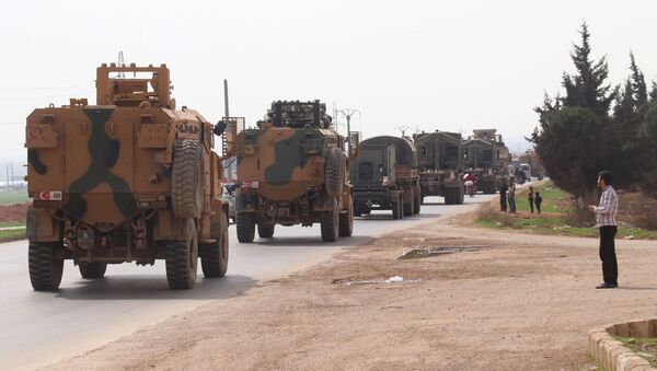 A Turkish military convoy drives near the Syrian town of Kefraya on the highway linking the northwestern Syrian province of Idlib to the Bab al-Hawa border crossing with Turkey, on March 10, 2020 - Sputnik International