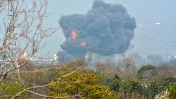 Smoke billows from the scene where a Pakistan Air Force F-16 fighter jet crashed in Islamabad, Pakistan March 11, 2020 - Sputnik International