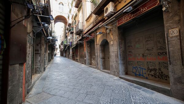 A view of an empty street on the second day of an unprecedented lockdown across all of the country, imposed to slow the outbreak of coronavirus, in Naples, Italy March 11, 2020 - Sputnik International