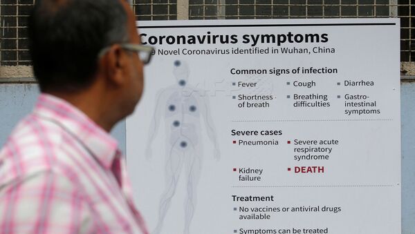A man reads a poster carrying messages on symptoms of coronavirus disease inside hospital premises in Kolkata, India March 5, 2020.  - Sputnik International