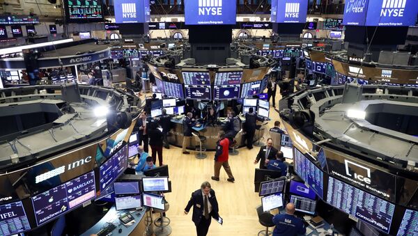 Traders work on the floor of the New York Stock Exchange (NYSE) after the opening bell of the trading session in New York, U.S., March 13, 2020 - Sputnik International