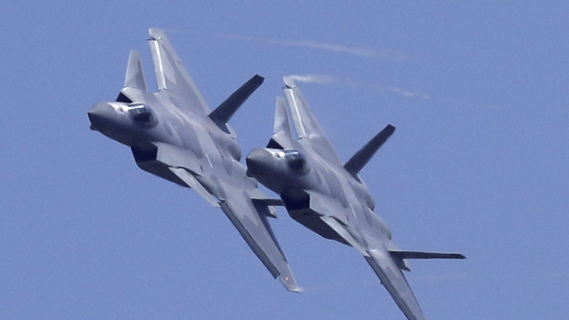 Two J-20 stealth fighter jets of the Chinese People's Liberation Army (PLA) Air Force performs during the 12th China International Aviation and Aerospace Exhibition, also known as Airshow China 2018, Tuesday, Nov. 6, 2018, in Zhuhai city, south China's Guangdong province - Sputnik International, 1920, 25.06.2021