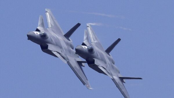 Two J-20 stealth fighter jets of the Chinese People's Liberation Army (PLA) Air Force performs during the 12th China International Aviation and Aerospace Exhibition, also known as Airshow China 2018, Tuesday, Nov. 6, 2018, in Zhuhai city, south China's Guangdong province - Sputnik International