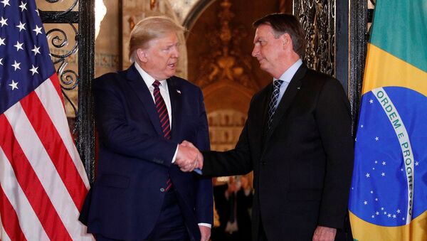US President Donald Trump shakes hands with Brazilian President Jair Bolsonaro - Sputnik International