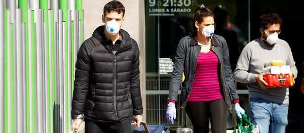 People wearing protective masks walk out of a supermarket, amidst concerns over Spain's coronavirus outbreak in central Madrid People wearing protective masks walk out of a supermarket, amidst concerns over Spain's coronavirus outbreak in central Madrid - Sputnik International