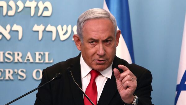 Israeli Prime Minister Benjamin Netanyahu gestures as he delivers a speech at his Jerusalem office, regarding the new measures that will be taken to fight the coronavirus, March 14, 2020. - Sputnik International