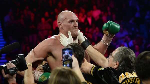 Tyson Fury celebrates after defeating Deontay Wilder in their WBC heavyweight title bout - Sputnik International