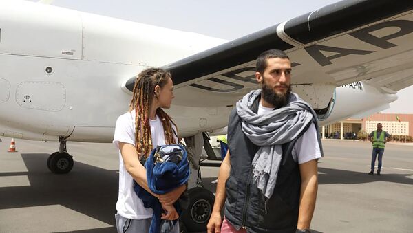 Canadian Edith Blais and Italian Luca Tacchetto, right, who were kidnapped 15-months ago in Burkina Faso, after they were freed in Bamako, Mali - Sputnik International