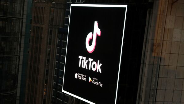The TikTok logo is seen on a screen over Times Square in New York City, U.S., March 6, 2020. - Sputnik International