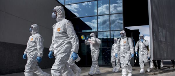 The UME (Emergency Army Unit) attend the train station in Granada, Spain Tuesday March 17, 2020. Police checked passports and IDs at the Pyrenees' border with France and along the 1,200 kilometer shared border with Portugal, as Spain re-established controls for incoming and outgoing travellers to stem the new COVID-19 coronavirus outbreak. For most people, the new coronavirus causes only mild or moderate symptoms. For some, it can cause more severe illness, especially in older adults and people with existing health problems. - Sputnik International