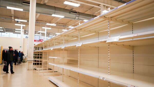 FILE PHOTO: Empty shelves of toilet roll and tissue inside a supermarket, as the number of coronavirus cases grow around the world, in London, Britain, March 15, 2020. - Sputnik International