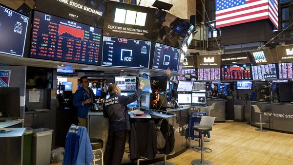 Traders work on the floor of the New York Stock Exchange near the end of the trading day, Monday, March 16, 2020 - Sputnik International