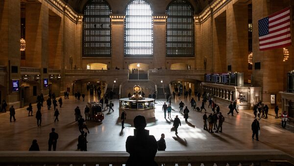Commuters walk through the lobby of Grand Central Station following the outbreak of coronavirus disease (COVID-19), in New York City, U.S., March 16, 2020. - Sputnik International