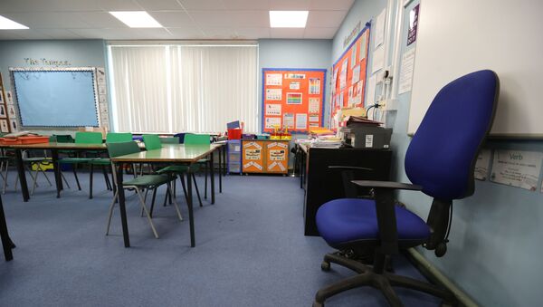 General view of an empty classroom in Staffordshire as the spread of the coronavirus disease (COVID-19) continues, in Staffordshire, Britain, March 18, 2020.  - Sputnik International